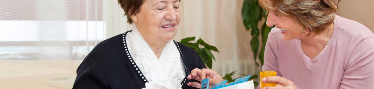 Home Health Nurse setting up meds